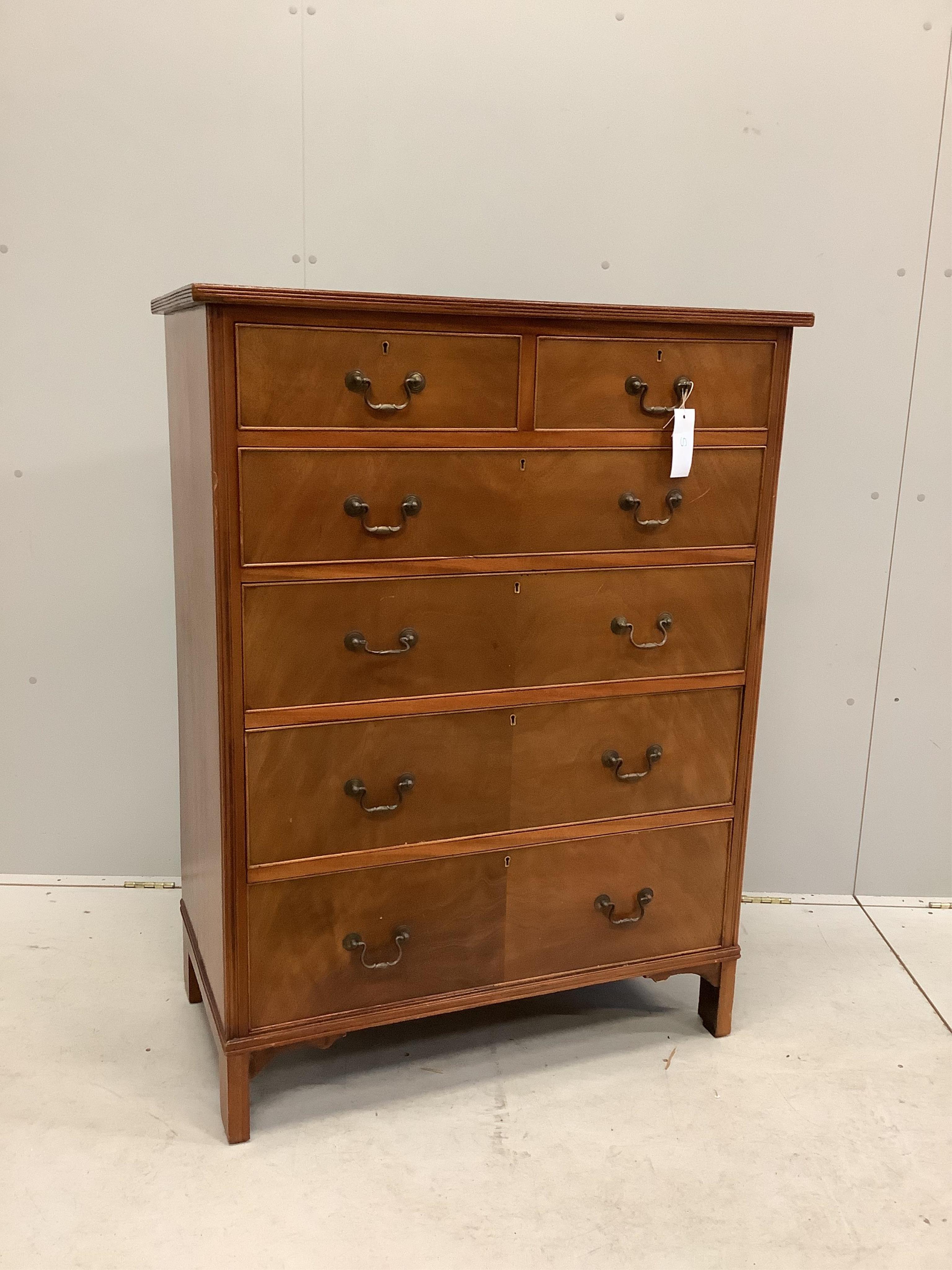 A George III style mahogany chest of two short and four long drawers, veneered fronts with brass loop handles, on bracket feet, width 91cm, depth 52cm, height 122cm. Condition - fair